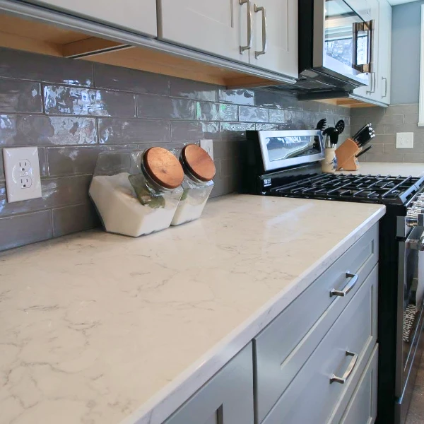 marble countertops with sugar and flour containers in a kitchen