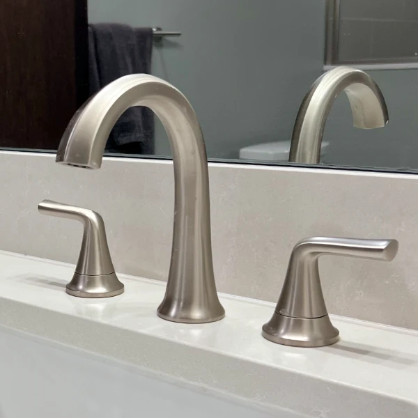 brushed nickel bathroom faucet with hot and cold handles