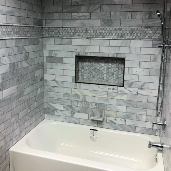 tiled shower/bath combo in a bathroom